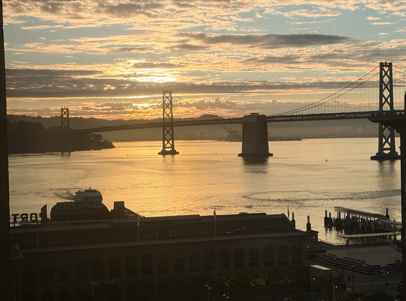 Bay Bridge at sunrise from the Embarcadero. Tuesday morning, first day at Okta.